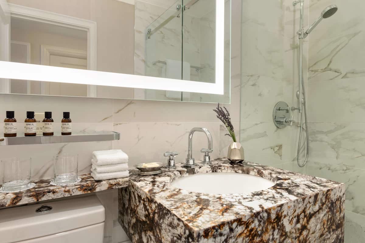 combined shower/bathtub, designer toiletries, hair dryer, bathrobes