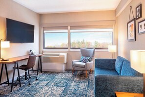 Suite, 1 King Bed with Sofa bed | Living room | Flat-screen TV, pay movies