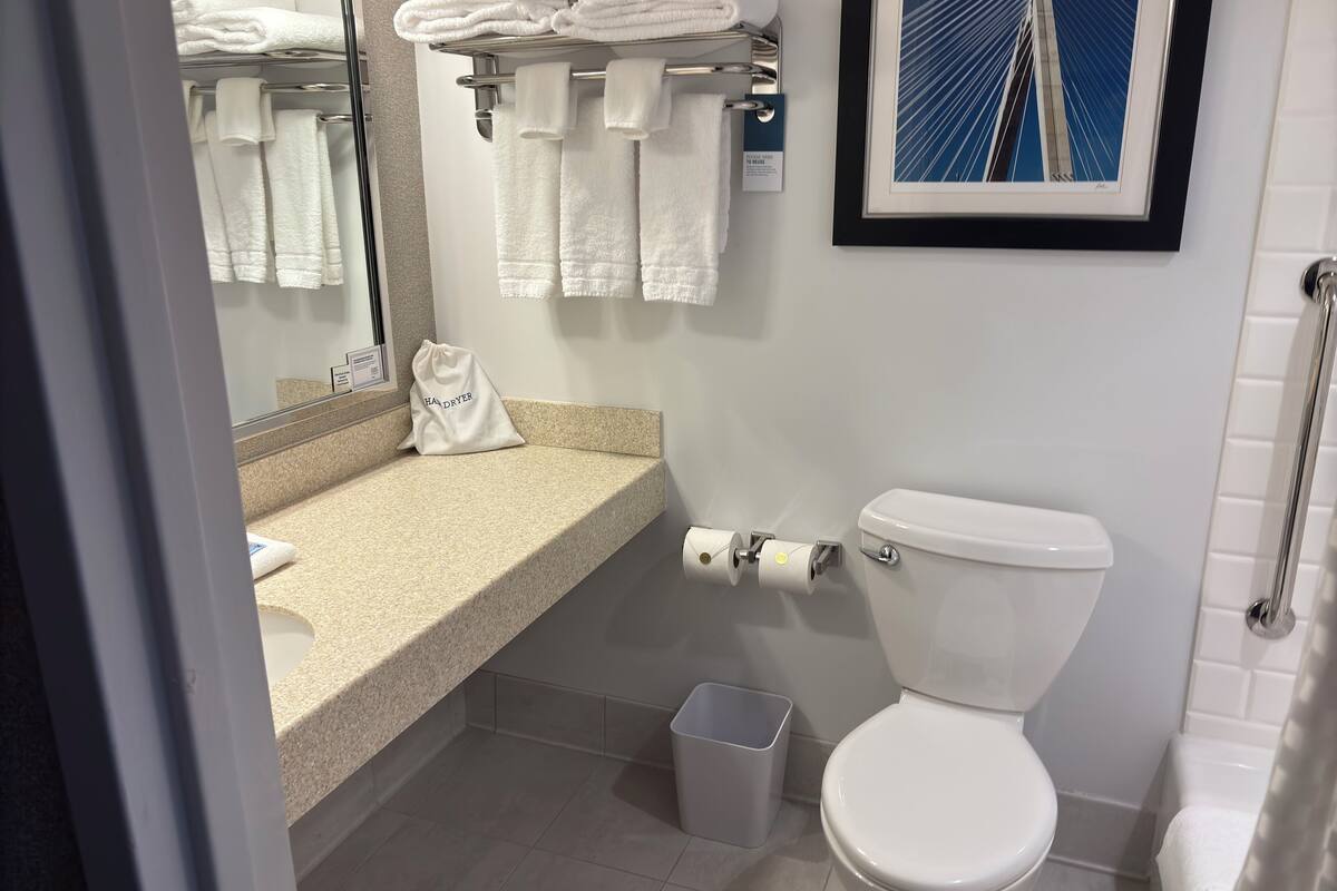 standard room, 1 king bed | bathroom | hair dryer, towels, soap, shampoo