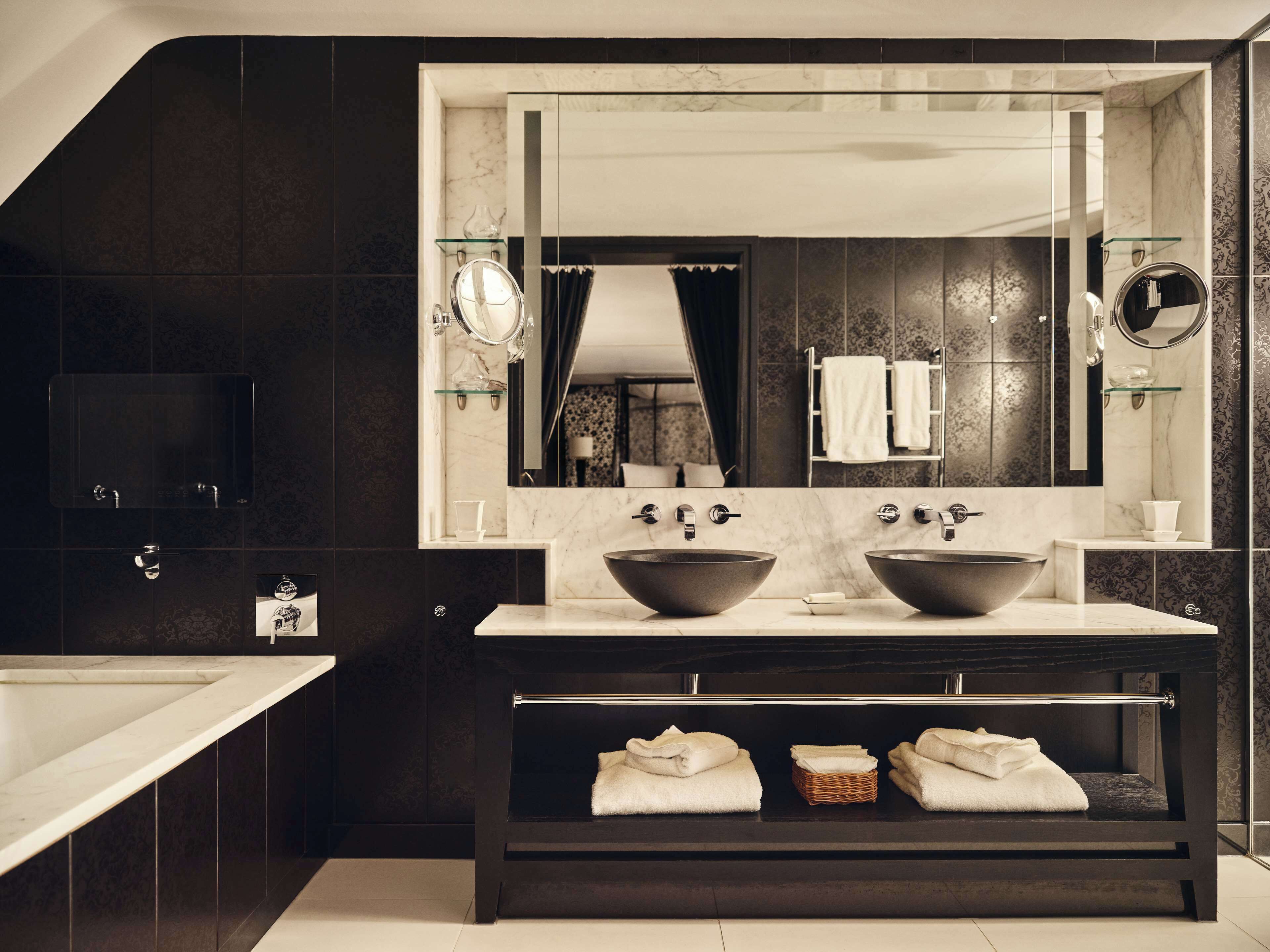 designer toiletries, hair dryer, bathrobes, slippers