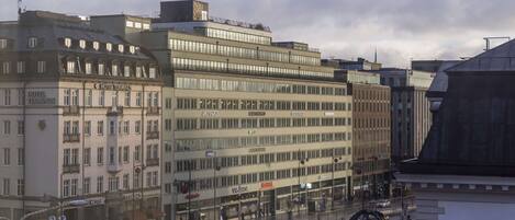 A multi-story hotel with a classic architectural style, featuring large windows and a central entrance.