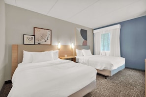 Premium bedding, pillowtop beds, desk, laptop workspace