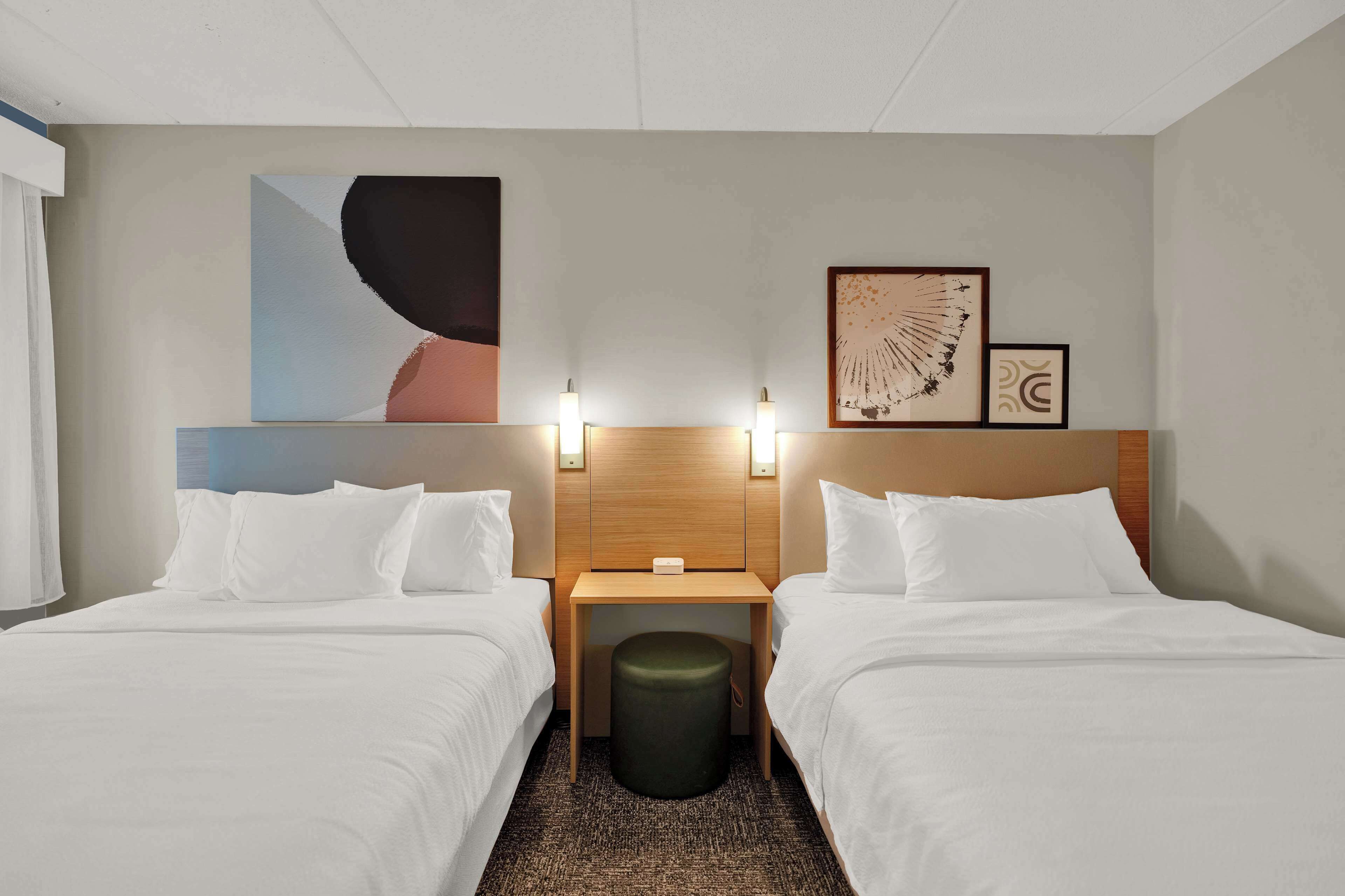 premium bedding, pillow-top beds, desk, laptop workspace