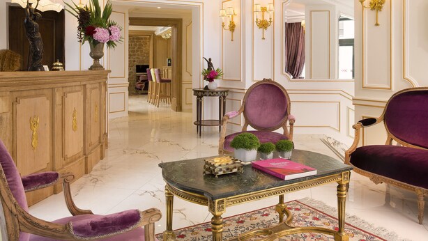 A luxurious lobby with a marble floor, ornate furniture, and decorative lighting. - Académie Hôtel Saint Germain (Paris)