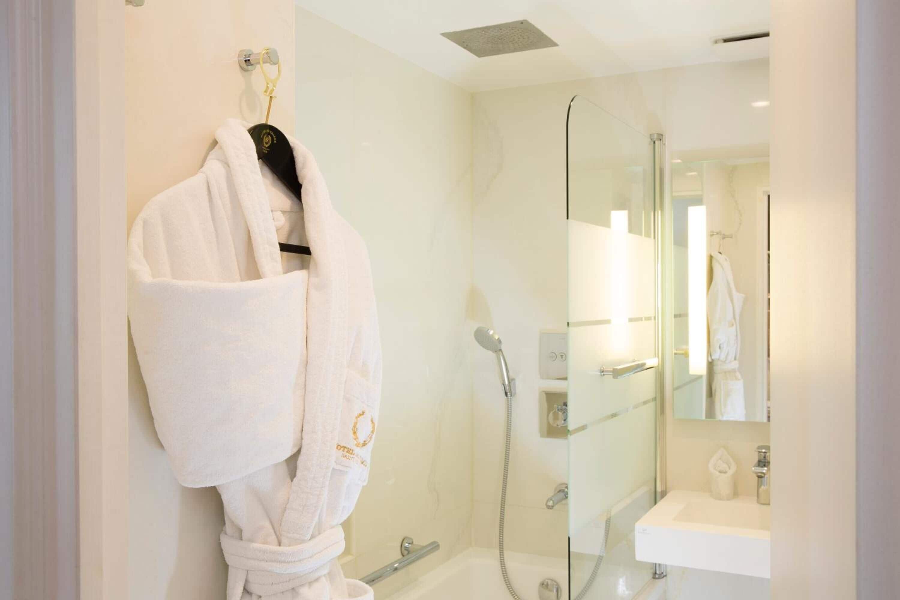 shower, hair dryer, bathrobes, slippers