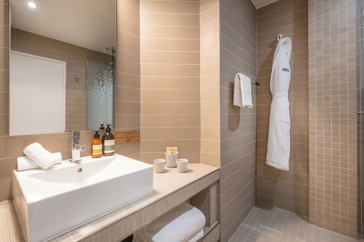 designer toiletries, hair dryer, bathrobes, towels