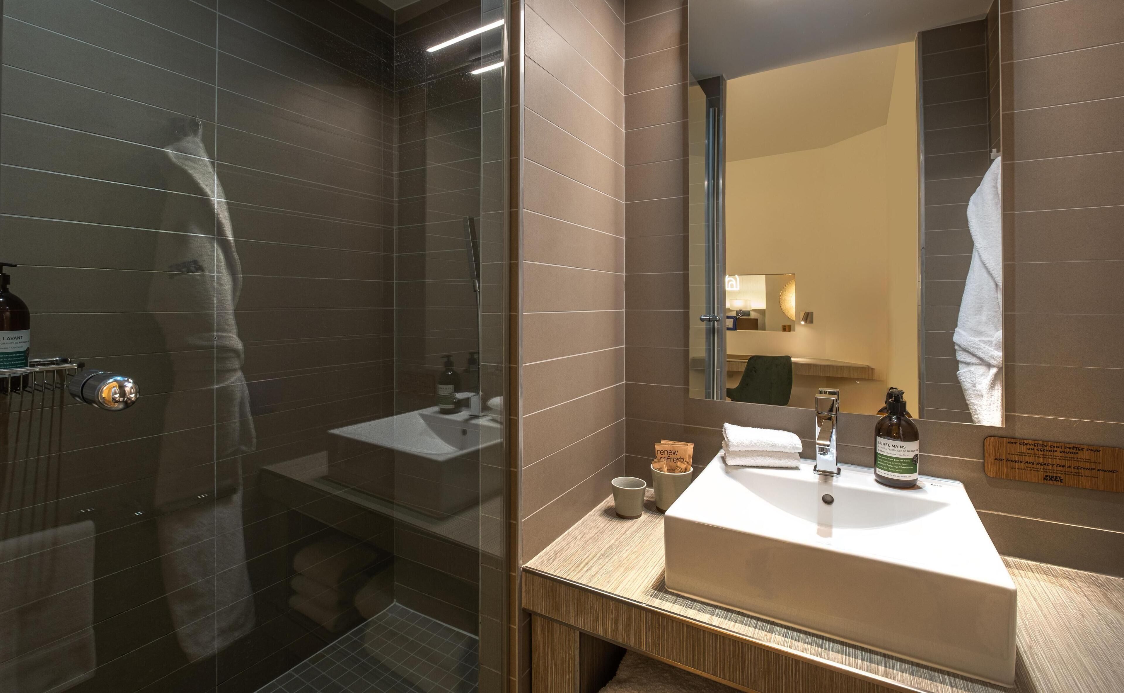 designer toiletries, hair dryer, bathrobes, towels