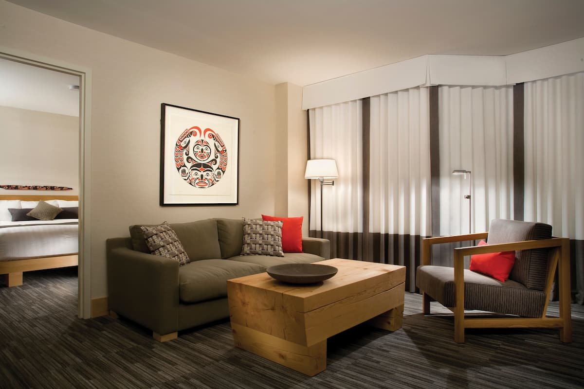 Studio Suite, 1 Bedroom | Living area | 55-inch Smart TV with cable channels, TV, iPod dock