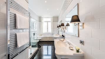 Separate tub and shower, rainfall showerhead, designer toiletries