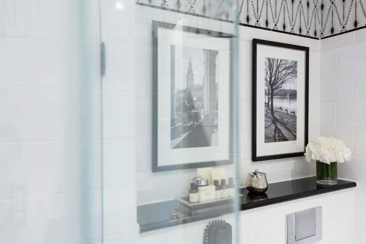 Separate bathtub and shower, rainfall showerhead, designer toiletries