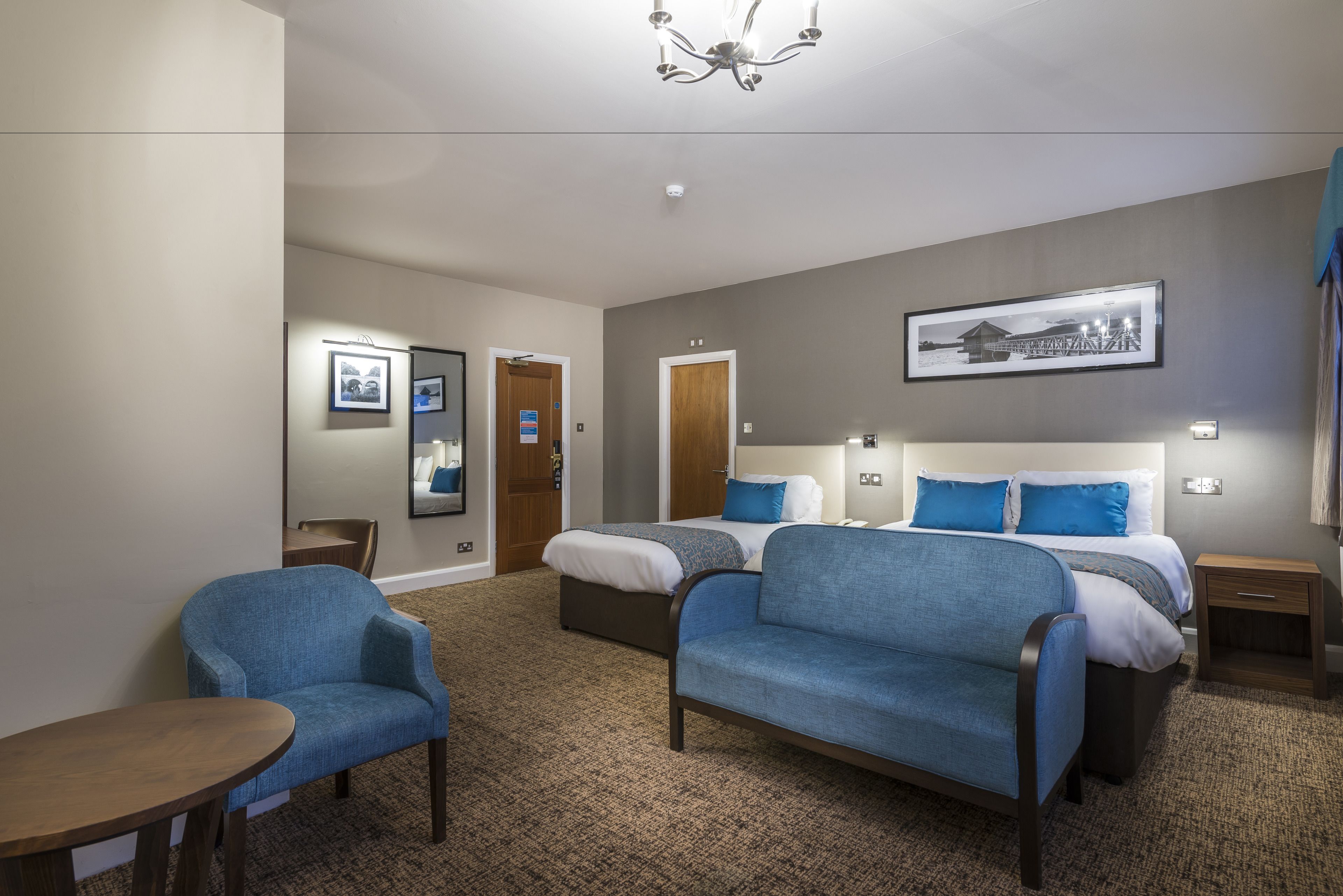 superior family room (4 people) | in-room safe, desk, blackout curtains, iron/ironing board