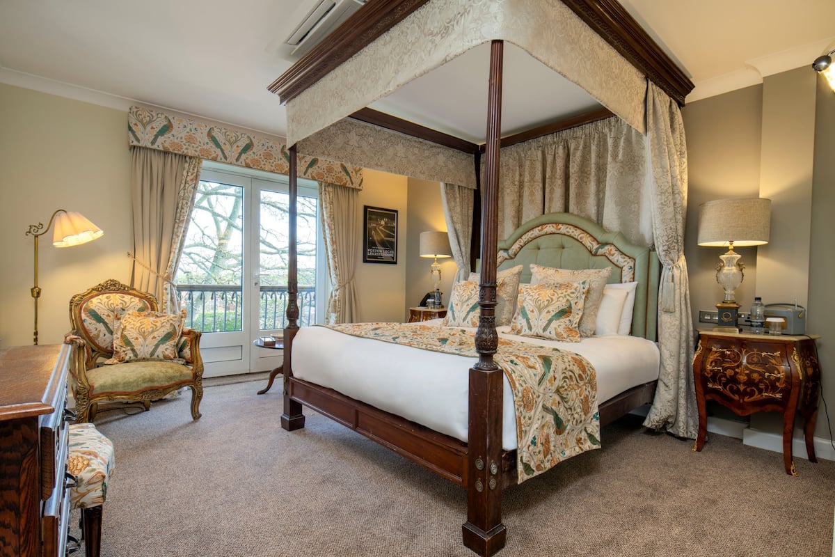 deluxe suite | in-room safe, desk, blackout curtains, iron/ironing board