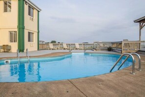 Seasonal outdoor pool, pool loungers