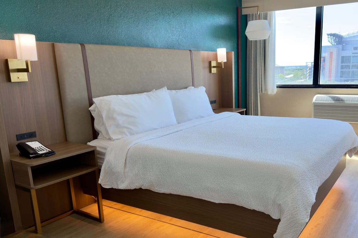 Desk, laptop workspace, blackout drapes, iron/ironing board