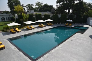 Outdoor pool, open 8:00 AM to 6:00 PM, pool umbrellas, sun loungers