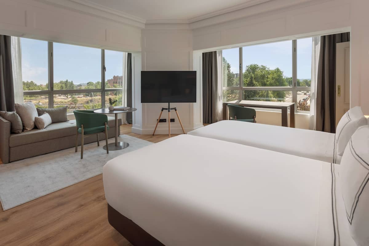 grand suite, the level, pool view | in-room safe, blackout curtains, soundproofing, iron/ironing board