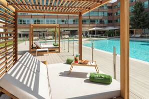 Seasonal outdoor pool, open 11 AM to 8:00 PM, pool loungers