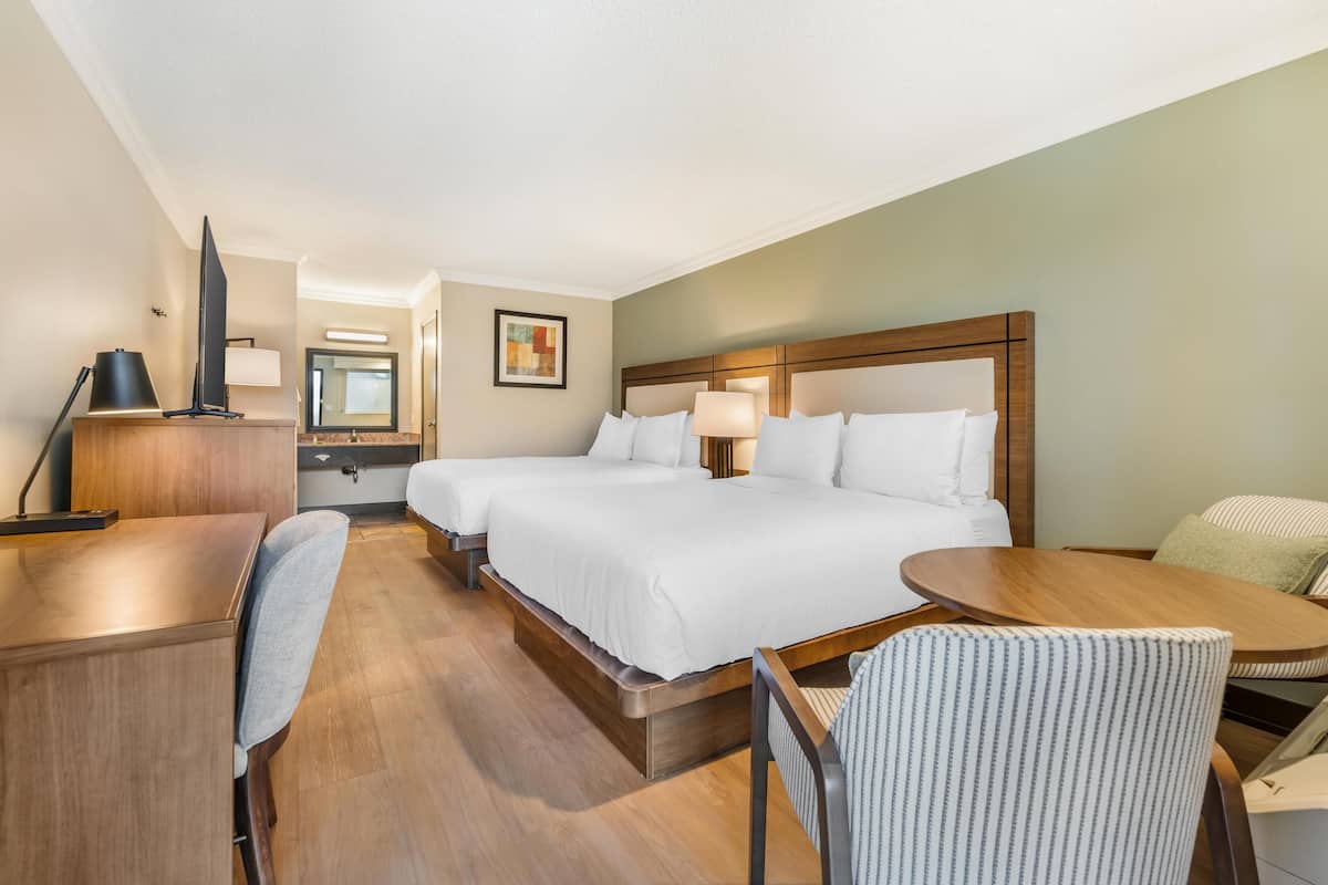 Standard Room, 2 Queen Beds, Non Smoking | In-room safe, desk, laptop workspace, blackout drapes
