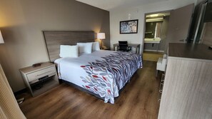 Desk, laptop workspace, blackout drapes, iron/ironing board