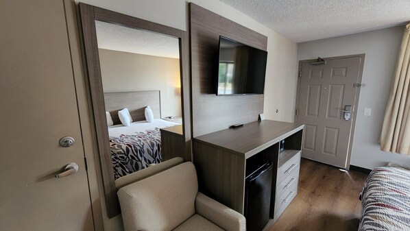 Desk, laptop workspace, blackout drapes, iron/ironing board