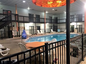 Indoor pool, open 8 AM to 10 PM, pool umbrellas
