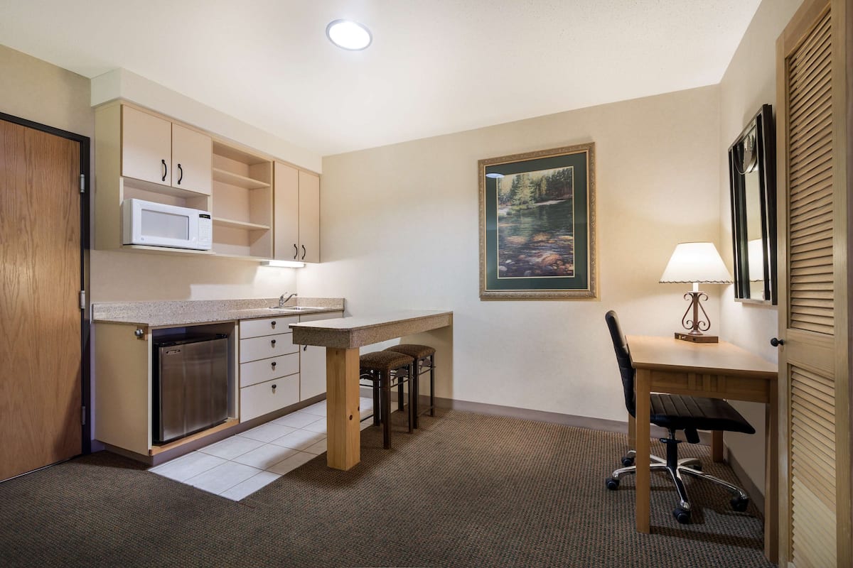 suite, 2 queen beds, non smoking, kitchenette (separate living room;with sofabed) | in-room safe, desk, iron/ironing board, free cots/infant beds