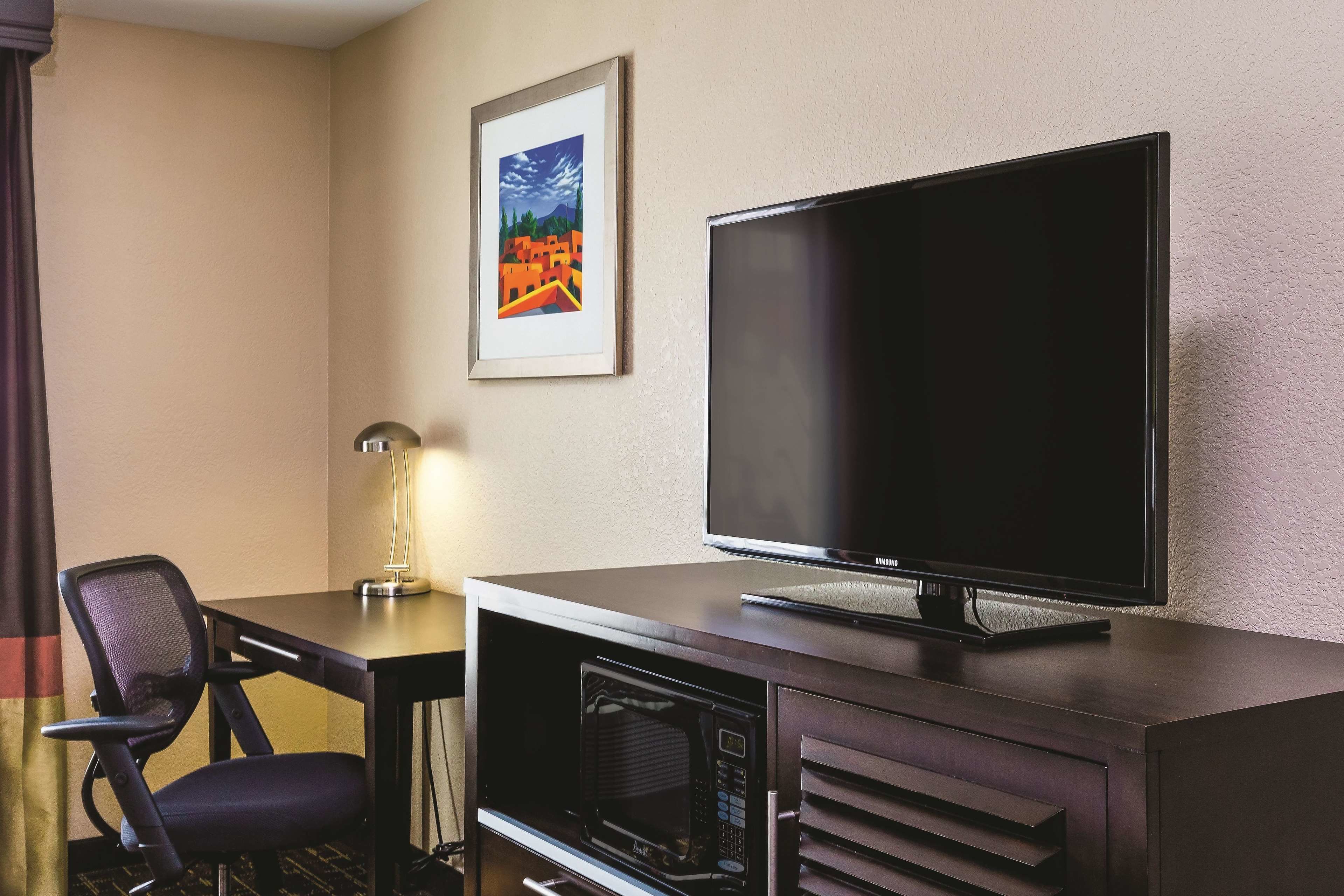 premium bedding, pillow-top beds, laptop workspace, blackout curtains