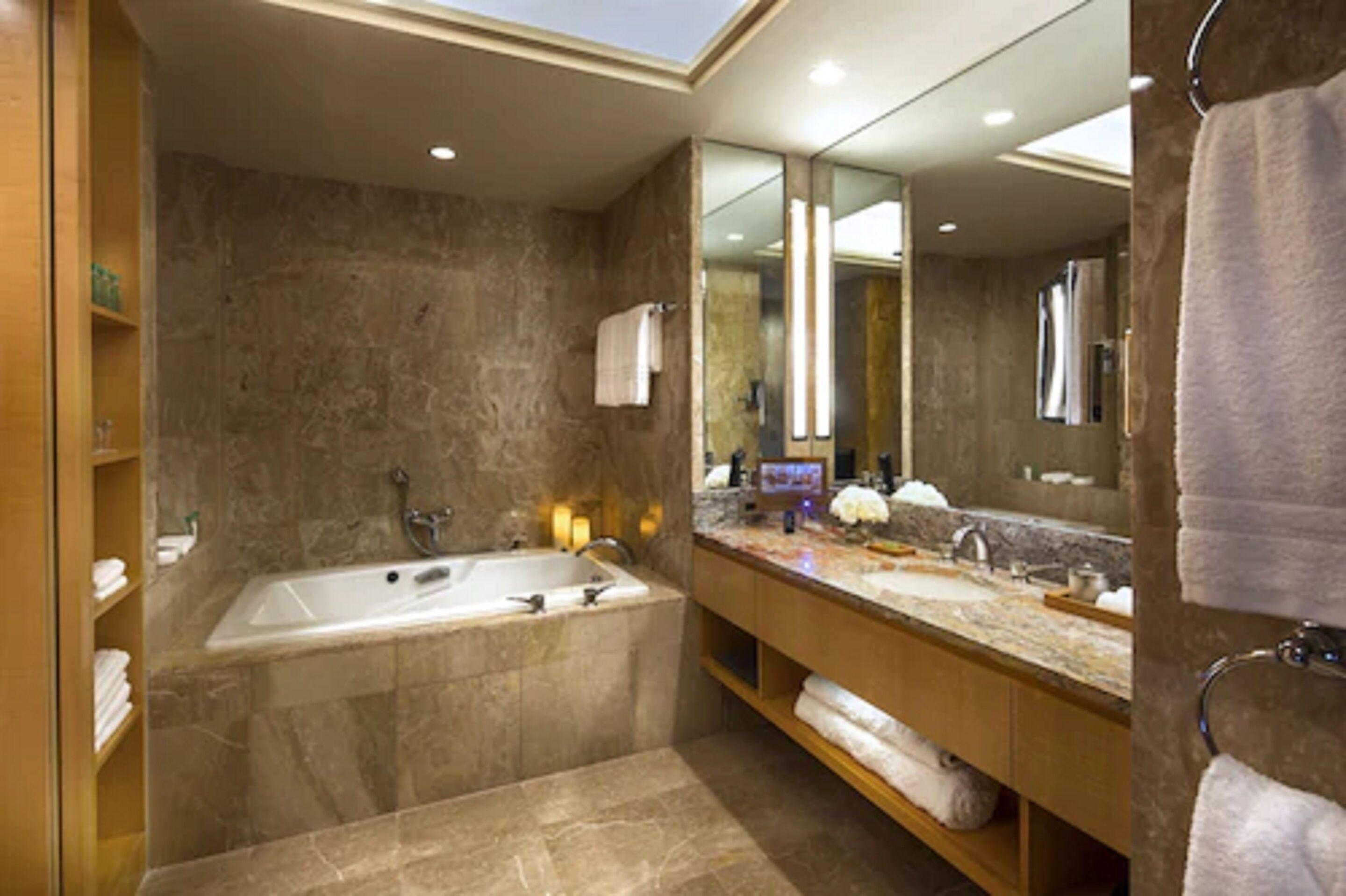 deep-soaking bathtub, designer toiletries, hair dryer, bathrobes