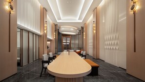 A conference room with a long table, chairs, and a modern ceiling design. - Holiday Inn Express Shenzhen Luohu Port by IHG (Shenzhen)