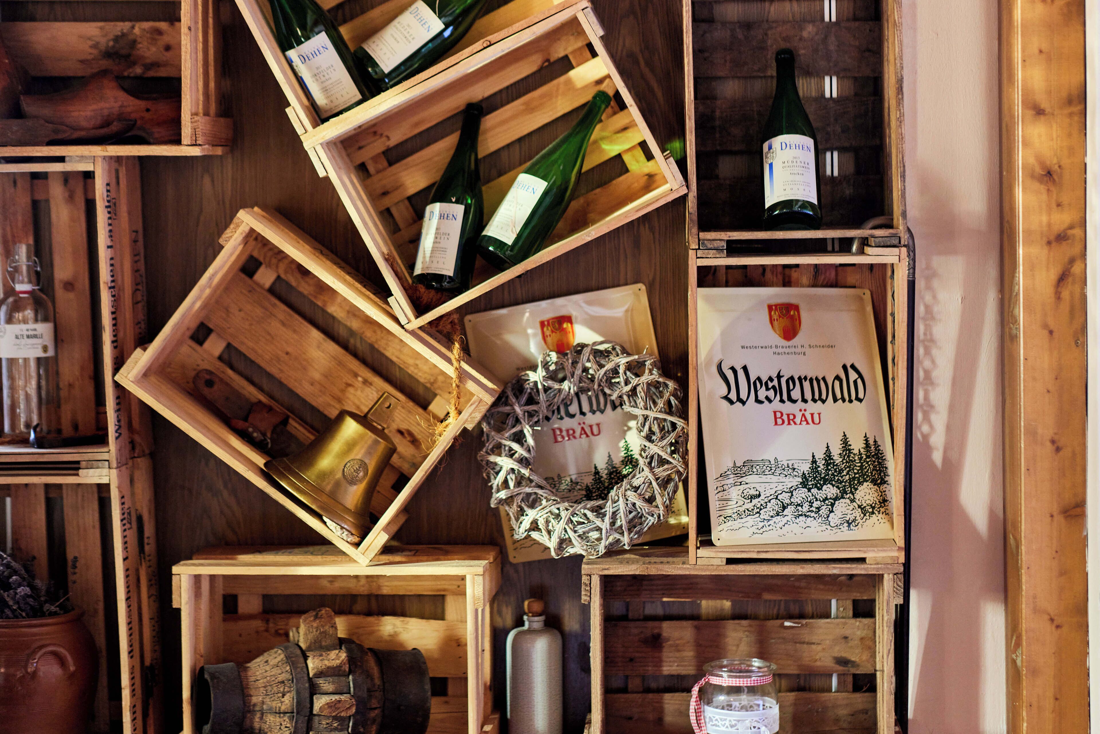 Wooden crates containing bottles and a framed certificate.