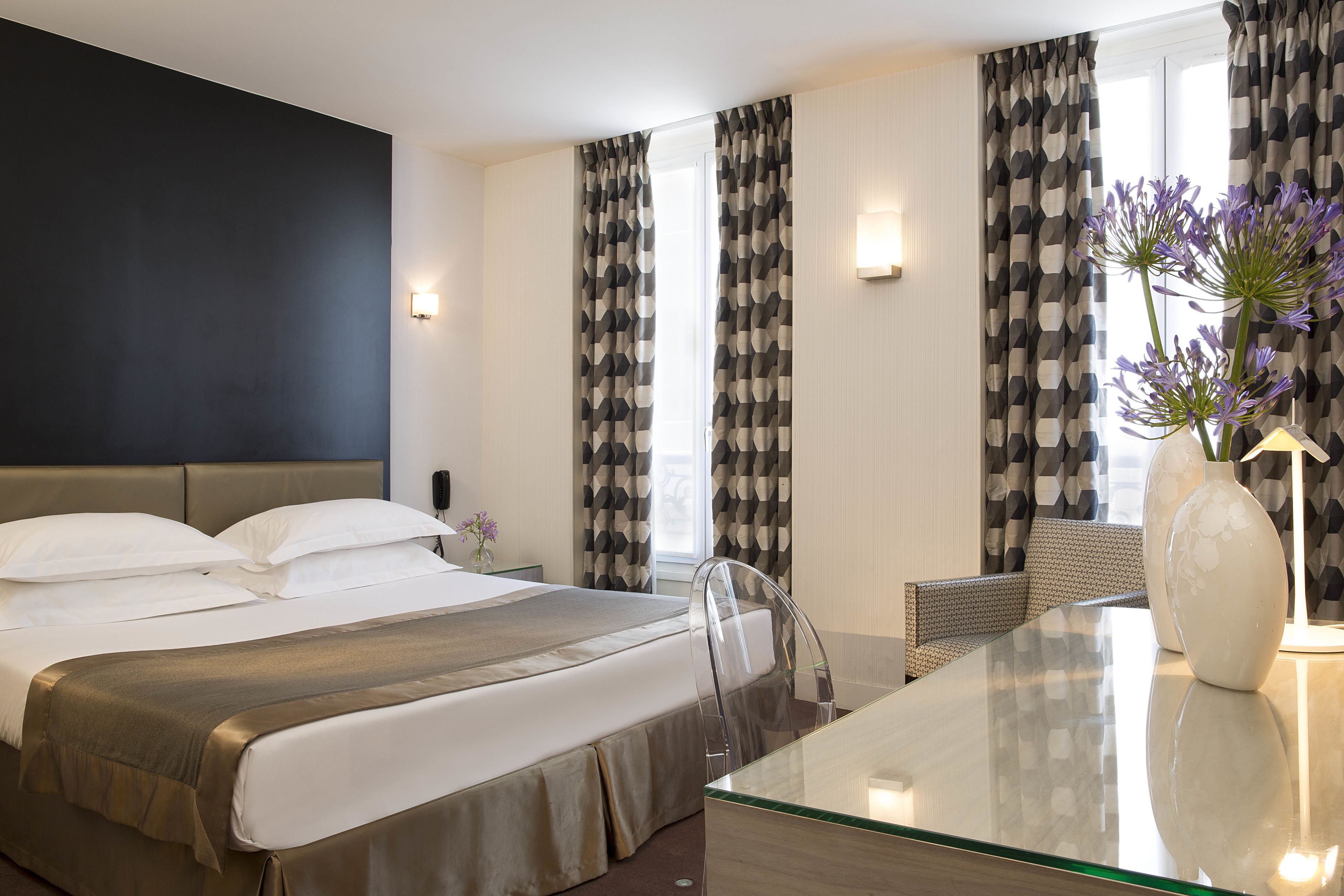 deluxe room | minibar, in-room safe, individually decorated, desk