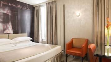 Deluxe Room | Minibar, in-room safe, individually decorated, desk