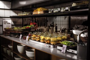 A kitchen counter with various food items and condiments. - Boutique Hotel SP34 (Copenhagen)