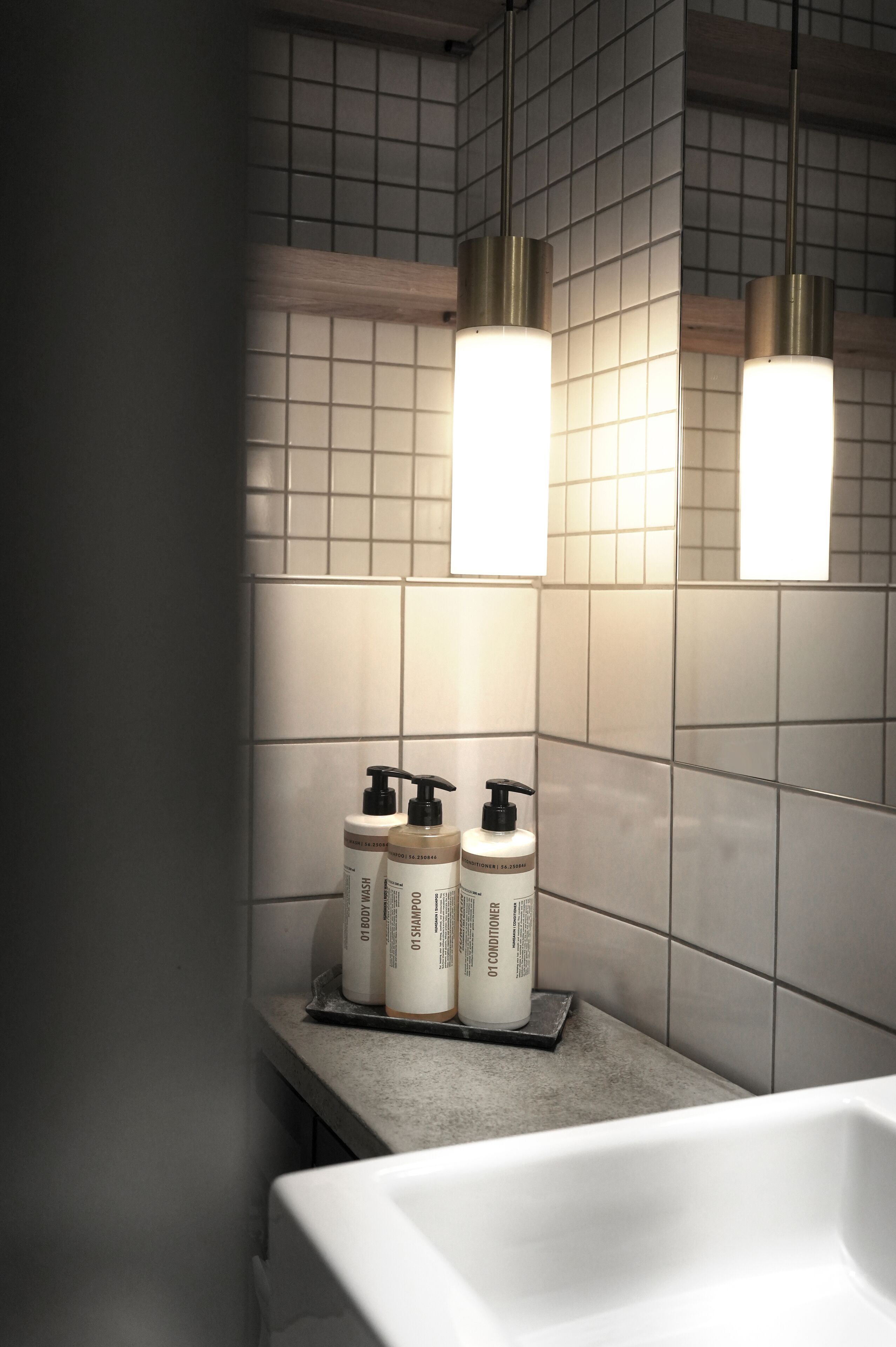 designer toiletries, hair dryer, towels, soap