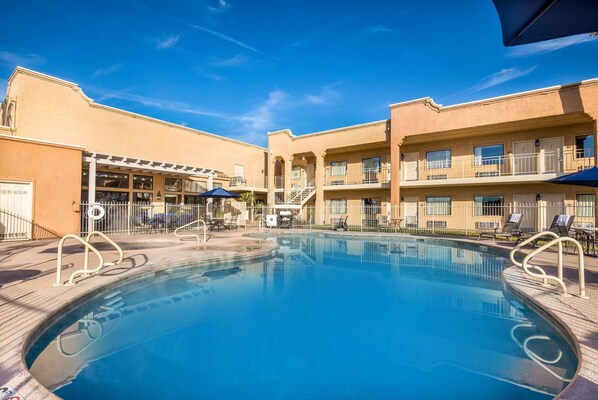 Seasonal outdoor pool, a heated pool, pool umbrellas, sun loungers