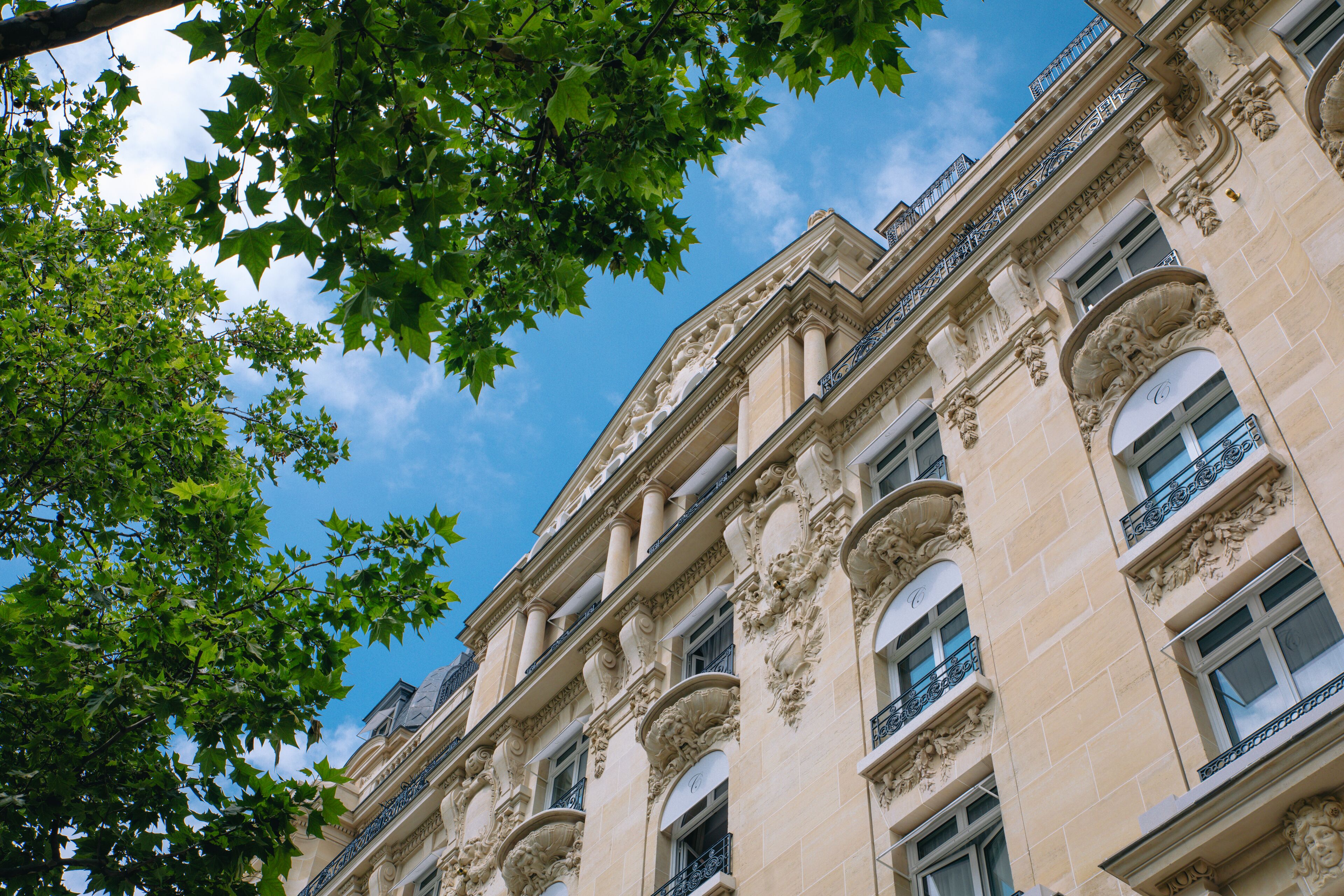 A classical building with ornate architectural details, including columns and decorative moldings.