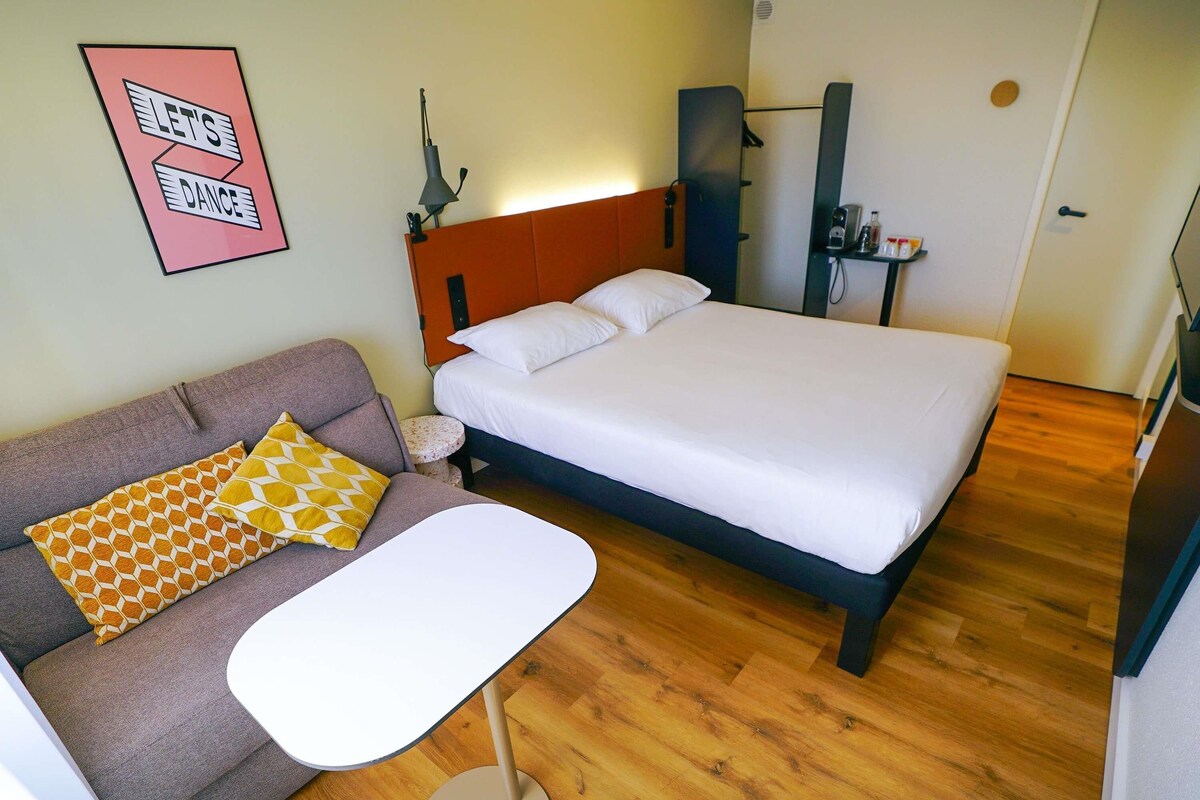 Premium bedding, desk, laptop workspace, blackout curtains