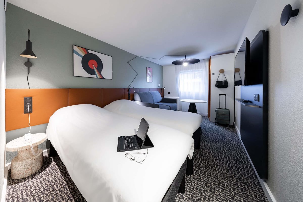 Premium bedding, desk, laptop workspace, blackout curtains