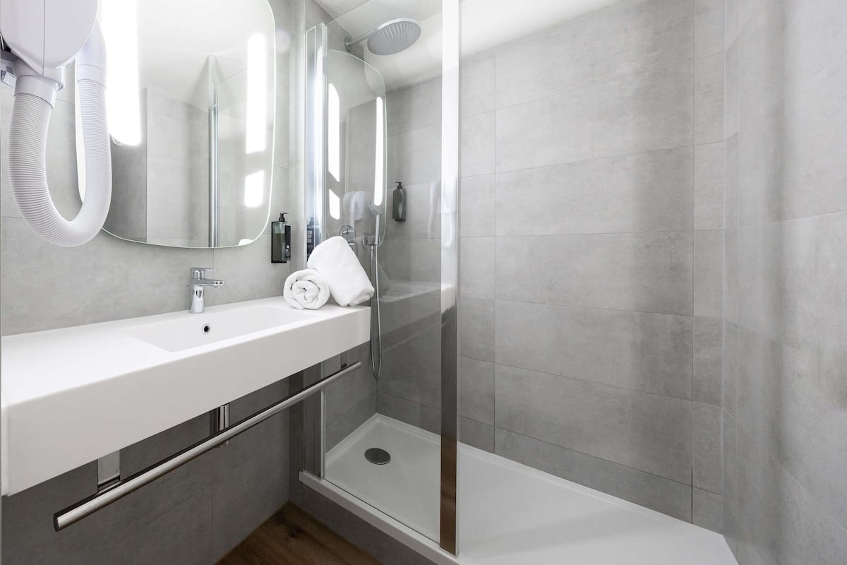 Premium bedding, desk, laptop workspace, blackout drapes