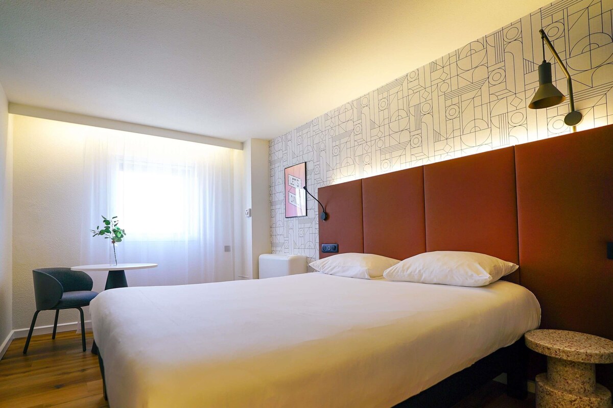 Premium bedding, desk, laptop workspace, blackout curtains