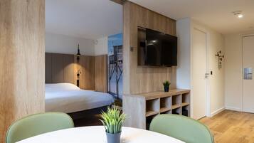 Premium bedding, desk, laptop workspace, blackout curtains