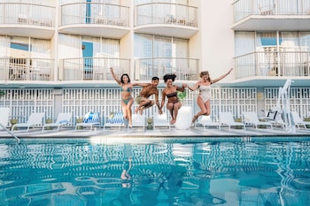 Outdoor pool, free cabanas, pool umbrellas at OUTRIGGER Waikiki Paradise Hotel