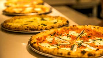 A row of pizzas on a table.