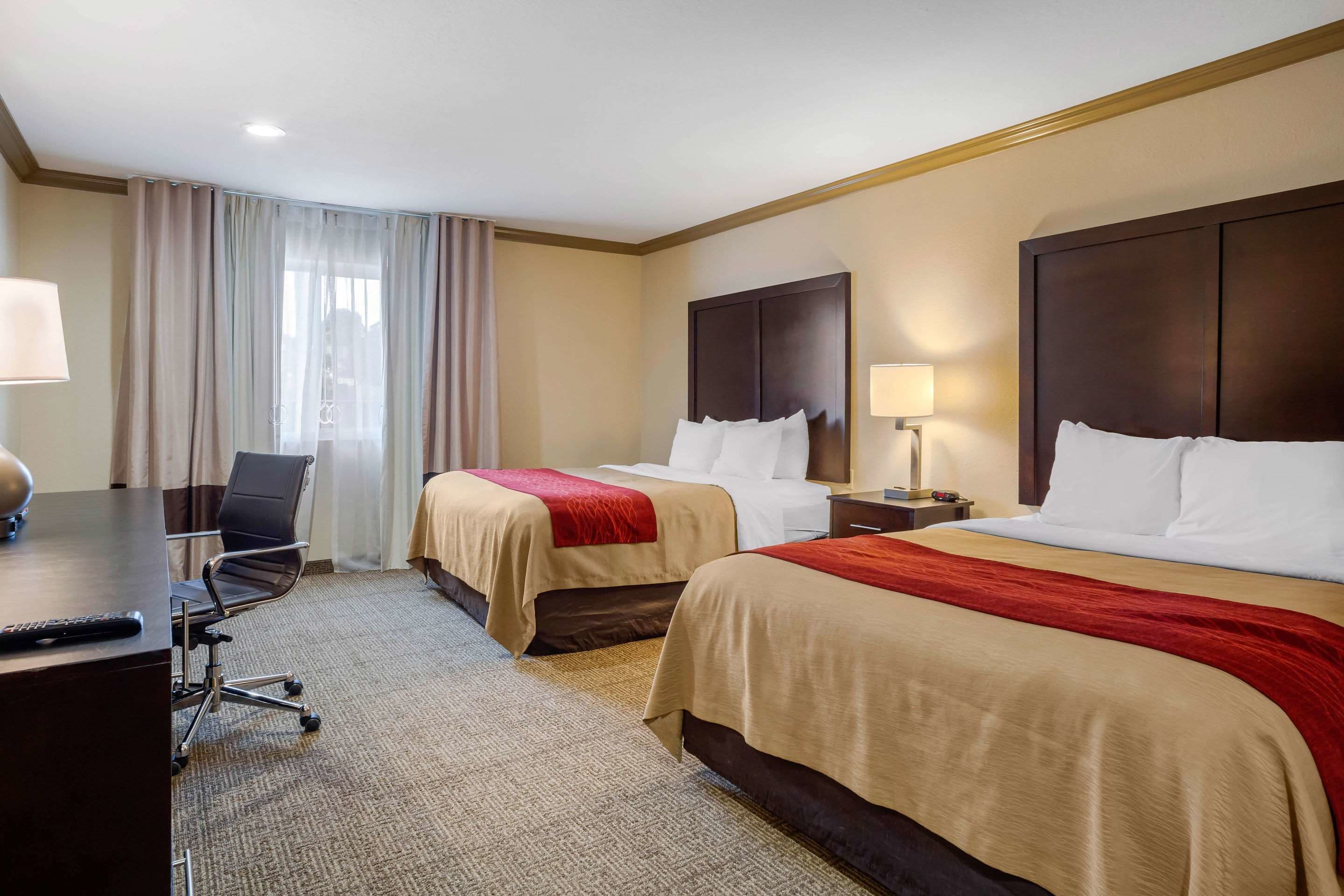 premium bedding, pillow-top beds, desk, laptop workspace