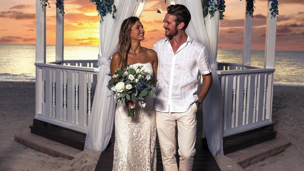 A gazebo with white railings and draped fabric, overlooking a beach at sunset. - The Westin Grand Cayman Seven Mile Beach Resort & Spa (Seven Mile Beach)