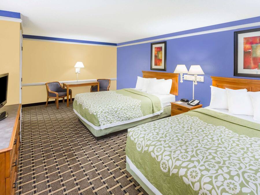 Desk, blackout drapes, iron/ironing board, free cribs/infant beds