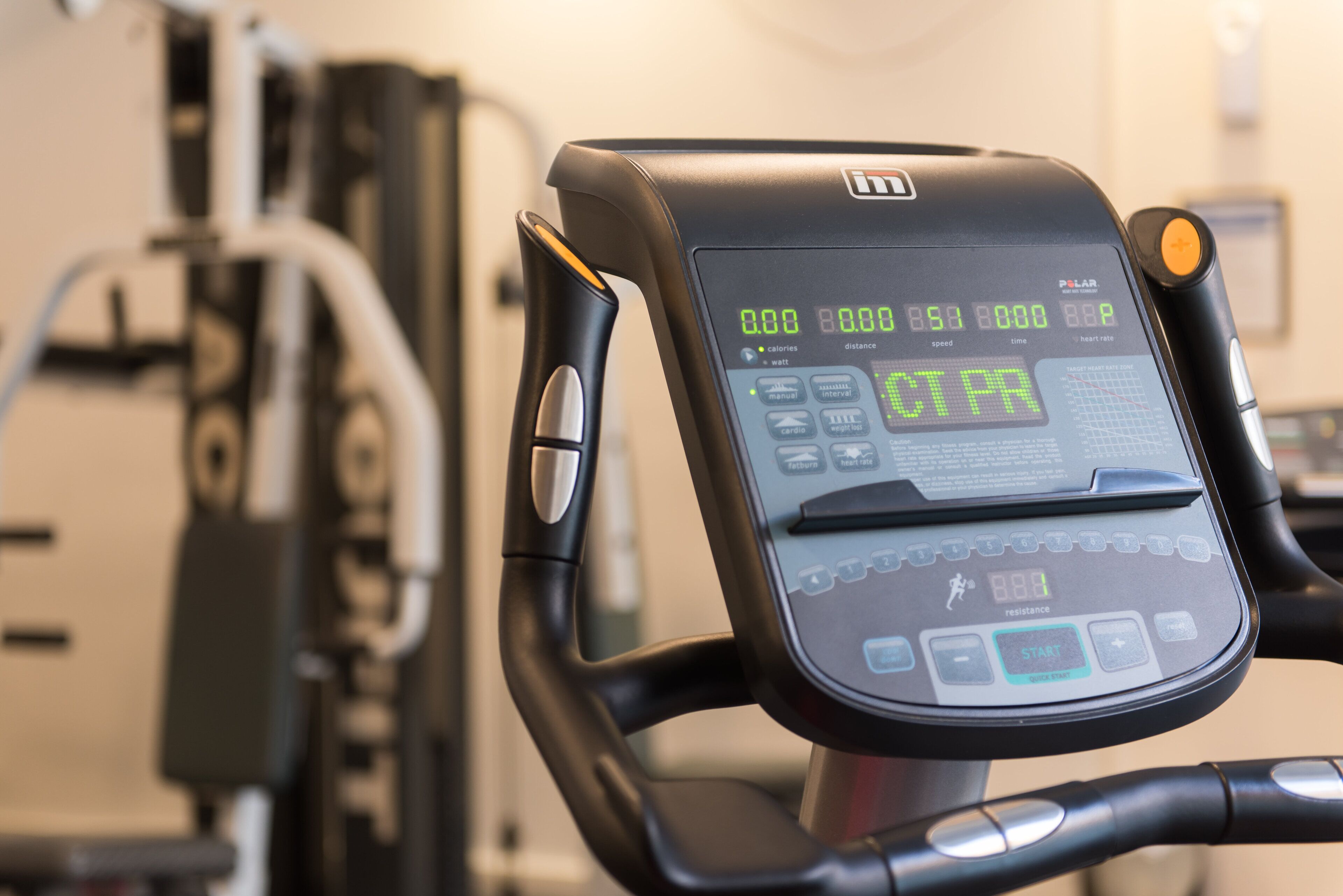 A stationary bike with a digital display and control panel.