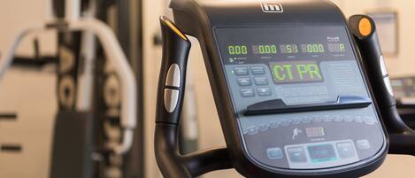 A stationary bike with a digital display and control panel.