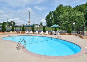 Seasonal outdoor pool, open 11:00 AM to 8:00 PM, pool umbrellas