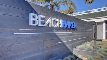 A wooden wall with the words "BEACH HAVEN" in large letters.